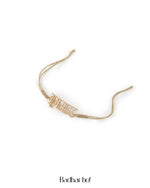 Gold bracelet on a white background with 'Badhai Ho!' text.