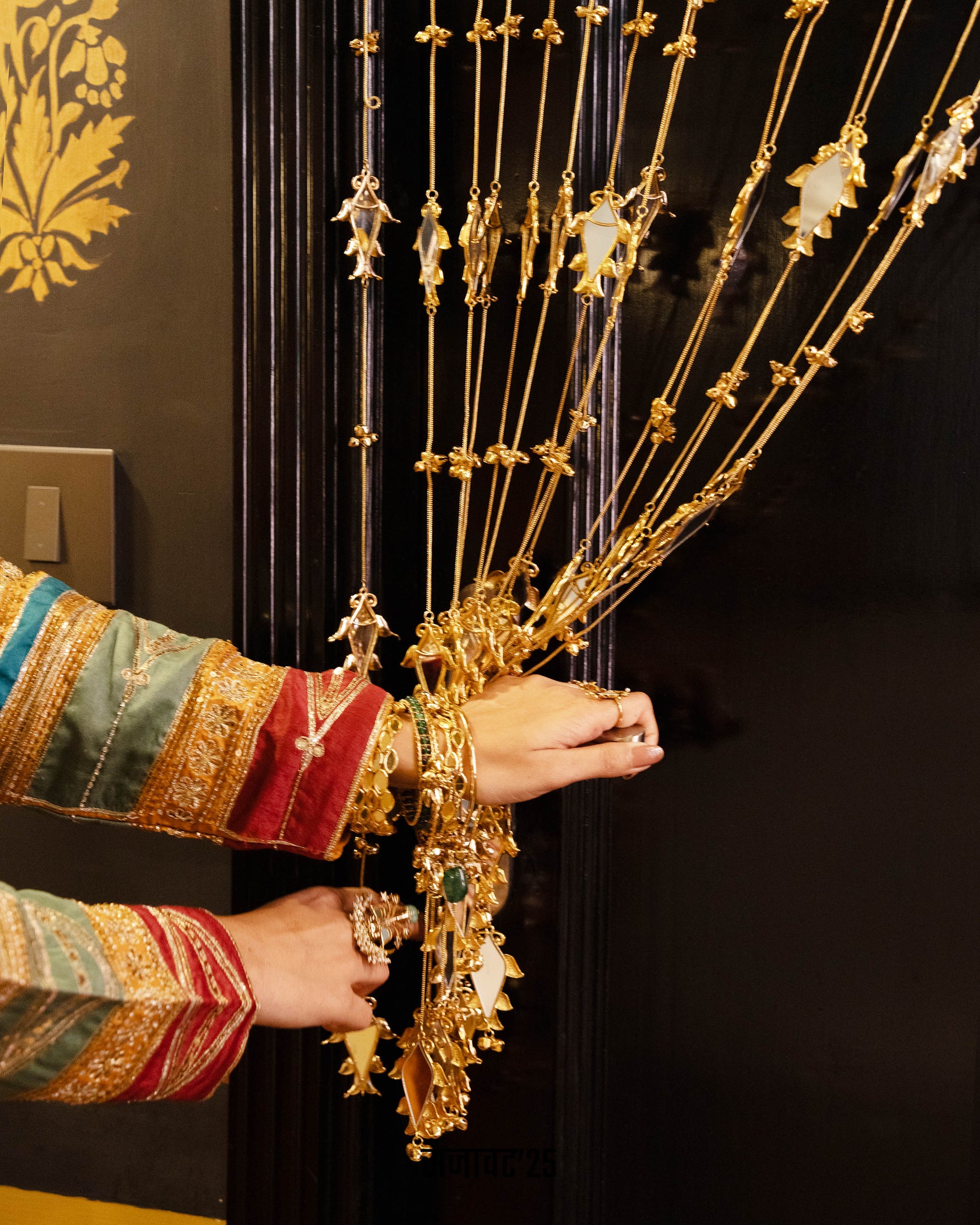 Decorative black door with gold patterns
