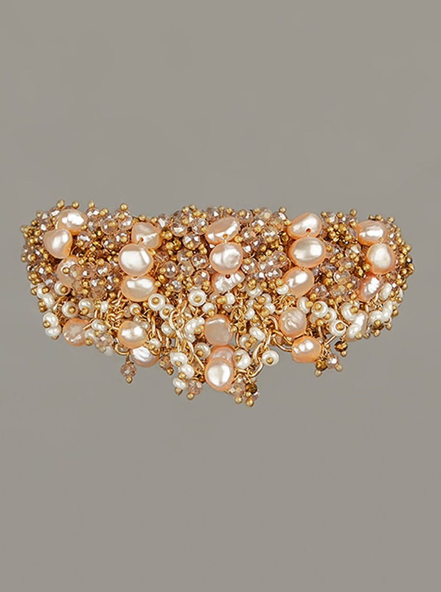 Contemporary Peach Pearl Studded Bracelet With Gold Beads