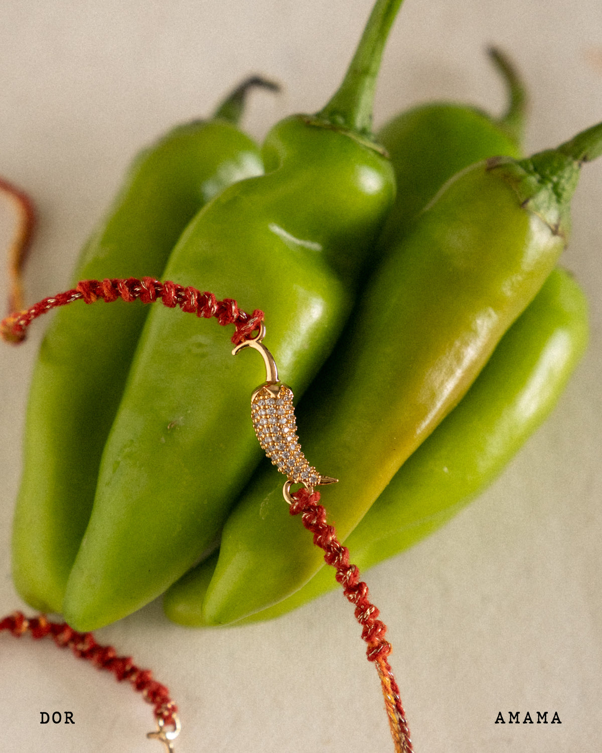Bracelet with chili pepper design on green peppers